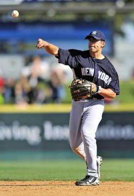 Yankee Doug Bernier teaches proper throwing mechanics.  Image by Ed Wolfstein.