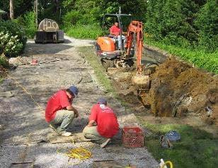 Working on drilling geothermal wells and digging a trench to connect the loop field to the residential geothermal system in MD.