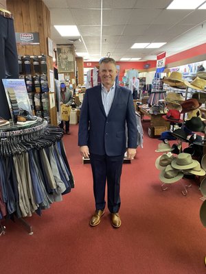 Suit fitting and alterations in an empty store.