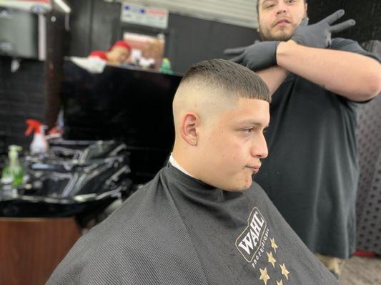 High bald fade edge up with scissor trim up top