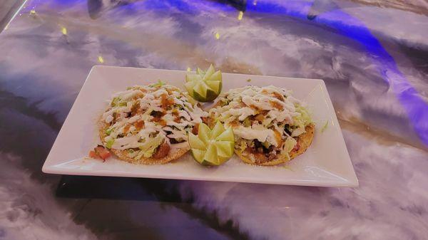 Street Tostadas topped with your choice of meat, beans, pico de gallo, sour cream and queso fresco.