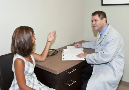 Dr. Brian Rotskoff, Chicago Allergist, with patient.