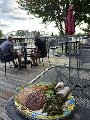 Spicy lentils, gomen, chickpea stew and injera