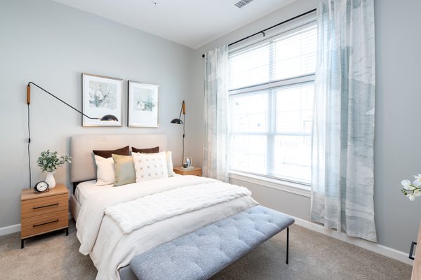 Bedroom with large windows providing natural light