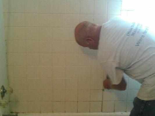 Owner Mike hard at work fixing a residential bathroom.