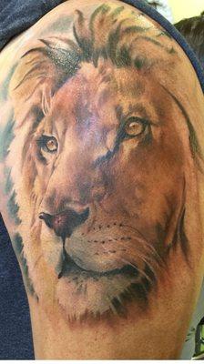 Lion tattoo on upper arm. Took about four hours to get this to this point.