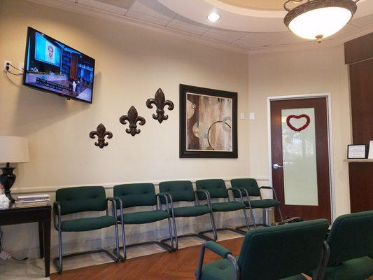 Comfy waiting room with TV and magazines. They usually have talk shows on.