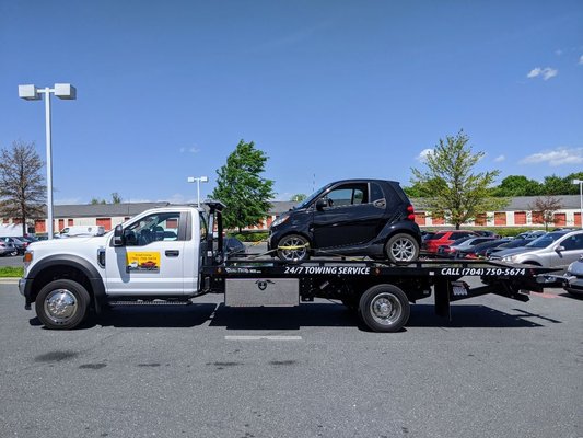 Smart For Two being towed by Snoork Towing in Charlotte.