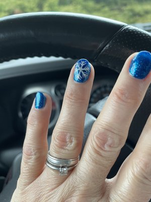 Gorgeous snowflake painted on my nails.