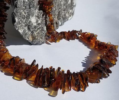 One of our lovely raw amber necklaces on display!