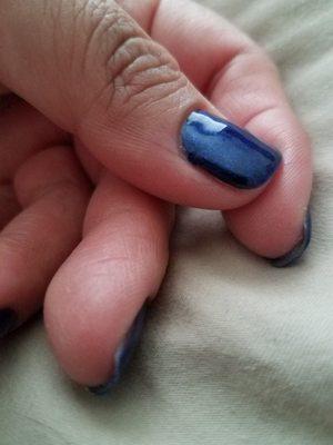 The polish is lifting off the nail on the bottom corner of the nail