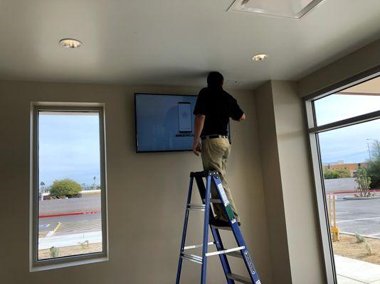 Mounting TV to wall, new retail store. Perfection, every time.