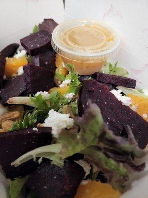 beet salad- roasted beets, mixed greens,  pistachios,  honey goat cheese w/ orange vinaigrette