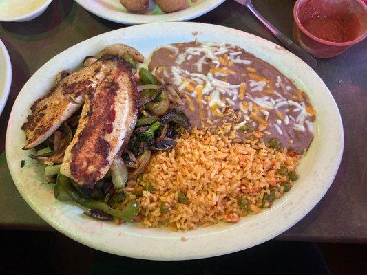 Special Dish made just for me! Rice and Beans with grilled veggies topped with a grilled Tilapia!