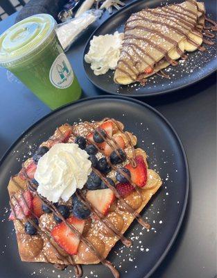 Bubble waffles and crepe with fresh fruit and Nutella drizzle. Green juice.