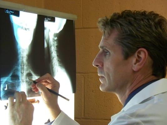 Dr. David R. Jones looking over x-rays.