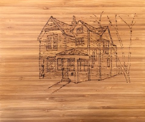 Chris sketches each buyer client's new home on cutting board (with a wood burning tool) as a closing gift-