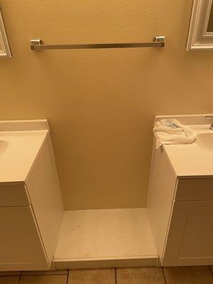 Cheap single vanities leaving this bizarre space between sinks.