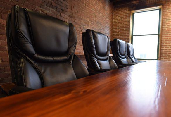 The conference room table was constructed on site with reclaimed beams from the Charlestown Armory.