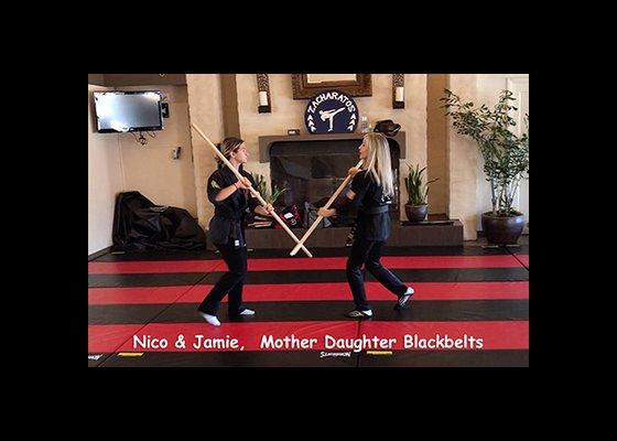 Zacharatos Karate Weapons class, Weapons instructor Jamie BenAziz-Zacharatos (3rd Dan) and Nico Zacharatos (2nd Dan) with Bo Staff