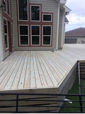 A massive deck we sanded. This picture was taken right before the stain was applied.