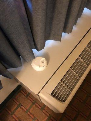 Smoke detector laying on ac