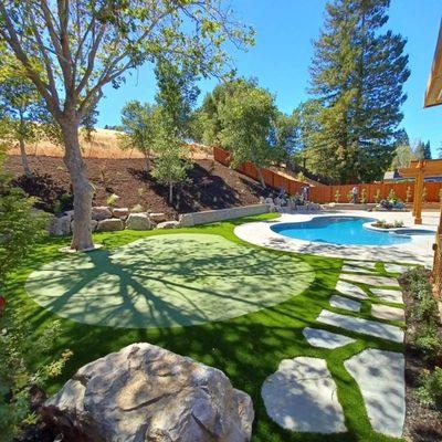 Beautify your yard with a putting green and evergreen lawn.