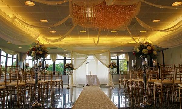 Indoor ceremony with a lovely panoramic view of the outside greenery