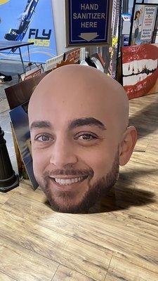 Card board cut out of the bachelor Luis helped get for the club.