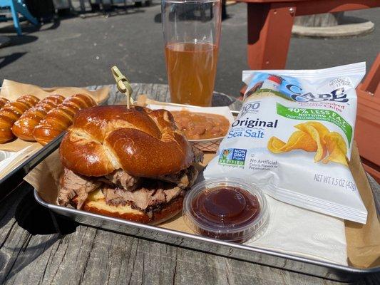 Brisket sandwich w/ baked beans, pretzels w/ cheese sauce & mustard. Served hot and fresh. Argo blueberry lemonade sour.