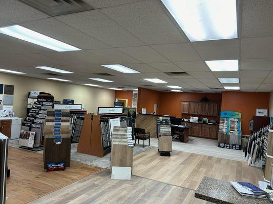 Showroom showcasing Hardwoods, Laminate, carpet, and LVP/LVT