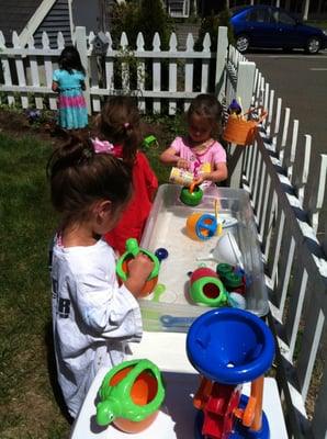 Playing with water in the garden during gardening class!