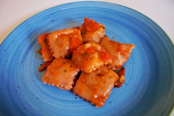 Homemade ravioli with eggplant and tomato