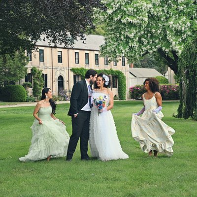 Couple with bridesmaids at estate wedding