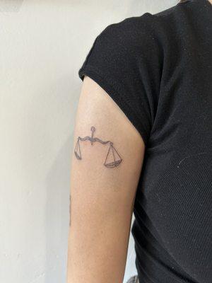 Libra tattoo done by Inked By L.A