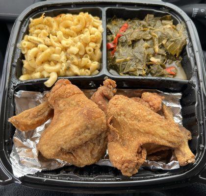 Full fried chicken wings platter with mac and cheese and collard greens.