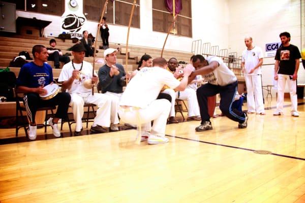 Mestre Urubu Malandro, playing Capoeira with Mestre Pinga Fogo.