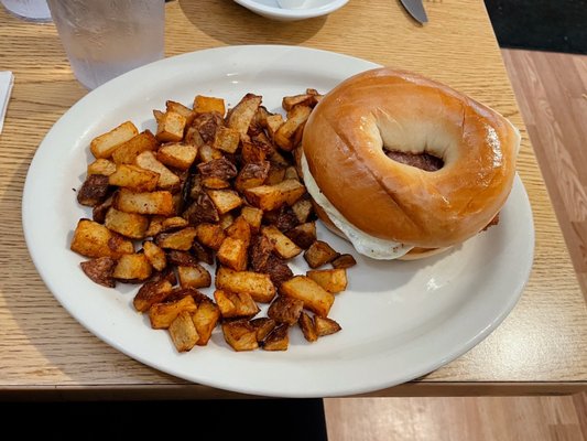 Bacon, egg & cheese breakfast sandwich and home fries