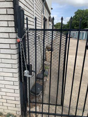 Chain padlocking the only exit. If there was a fire or any kind of emergency you would not be able to get out of this facility.