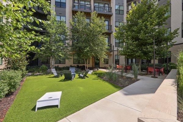 Outdoor courtyard and cornhole