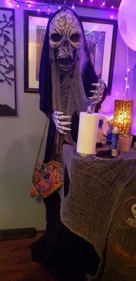 Bathroom decor. Skeleton being a great purse holder.