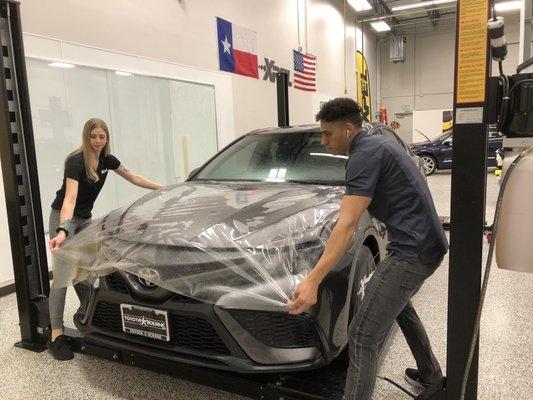 Toyota Camry getting XPEL ULTIMATE PLUS paint protection film.