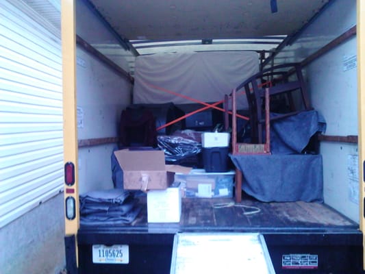 Another photo of us packing a truck.