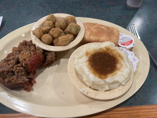 Meatloaf is delicious with mashed potatoes and gravy, fried okra and cornbread. $8.99. Well worth it.