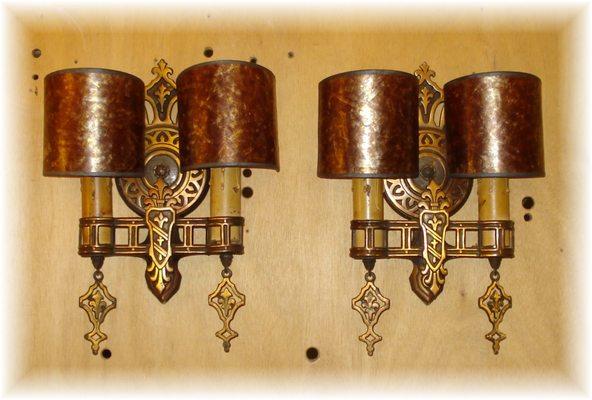 Pair of c. 1920 cast brass with copper wash finish sconces shown with amber mica clip shades