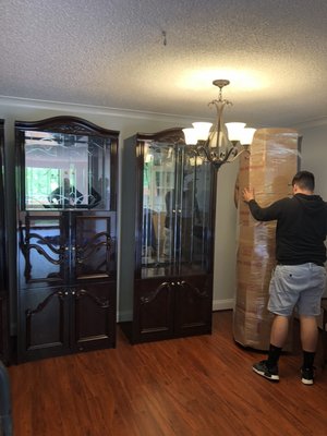 China Cabinets are wrapped accordingly before moving.