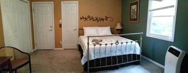 The Whitetail Suite is a spacious queen bedroom with a 2 room bath attached. A table and 2 chairs, HDTV, WIFI and a view to the woods.