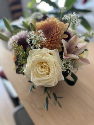 Sympathy flowers; gorgeous, soft autumn colors of cream, orange, white, pink, of burgundy.