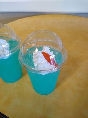 2022 Summer ocean themed signature drink- blue lemonade with whipped cream and gummy shark