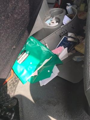 The contents of his glove box in the back seat